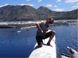 Shantelle Reamer working on the instrumentation of a floating log on Spirit Lake