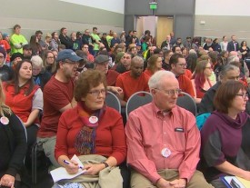 An overflow crowd packed rooms inside Tacoma's convention center 